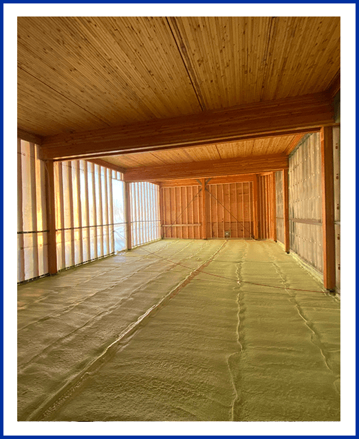 A large room with wooden walls and floor.